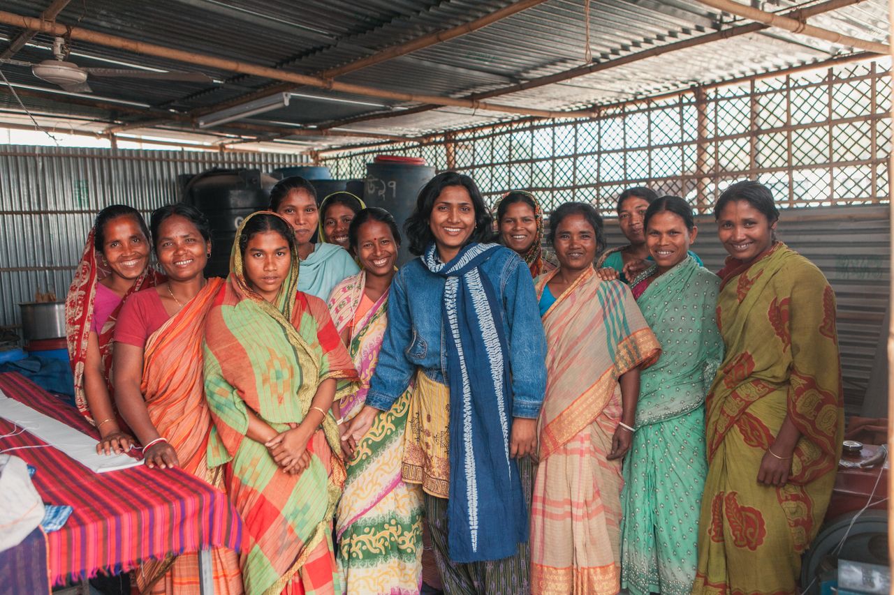 Group of women in colorful sarees working in a cooperative, Bangladesh.